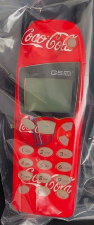 26141-1 € 10,00 coa cola GSM met cover.jpeg